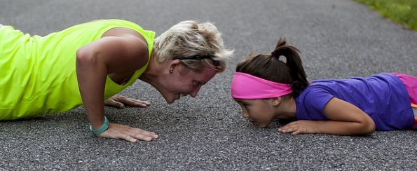 Mother and daughter exercising together