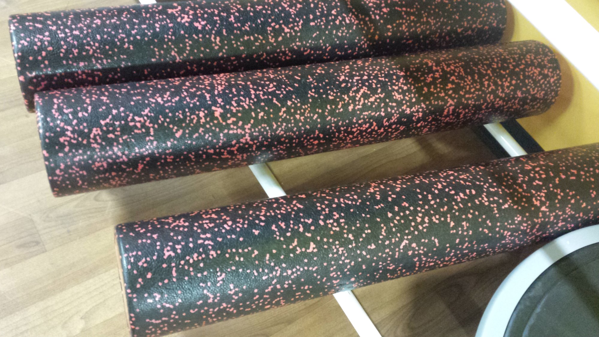 3 speckled foam rollers at the gym - photo by popular fitness