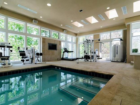 Home gym with a beautiful pool