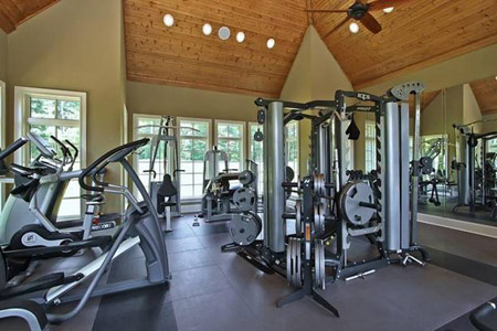 Home gym room with quality weight training and cardio equipment