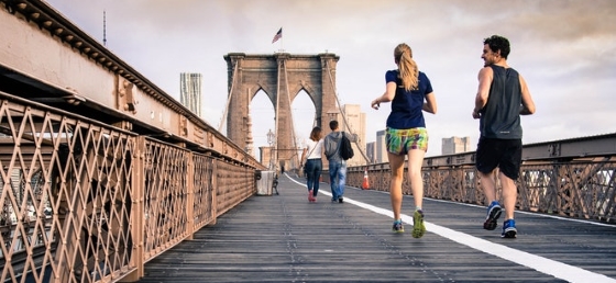 Joggers jogging on New York City bridge