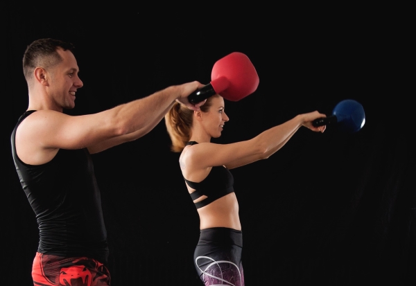 kettlebell swings exercise done by 2 people