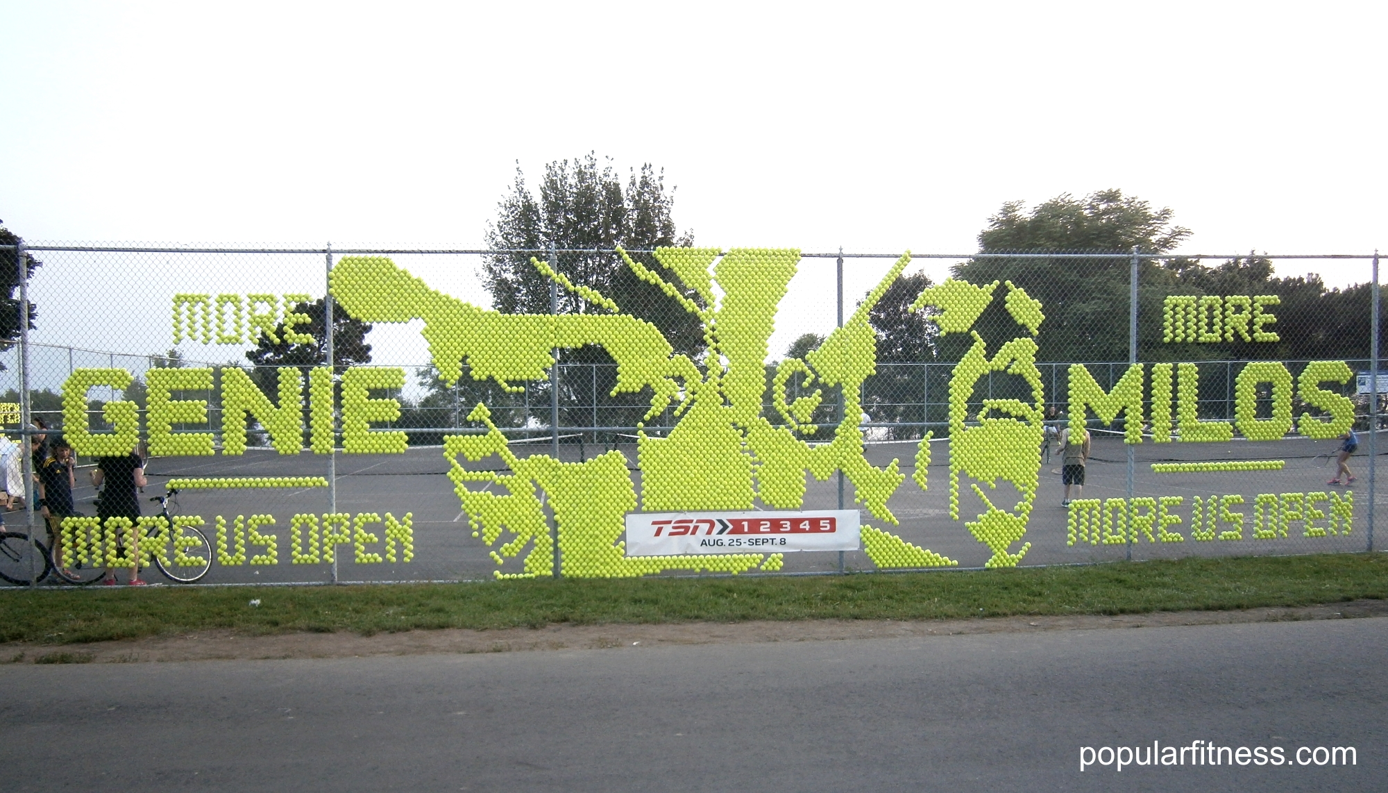 Fence art using tennis balls spelling out More Eugenie Bouchard and Milos Raonic