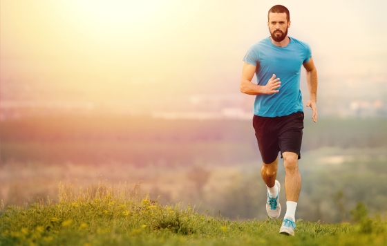 man doing cardio exercise by running outside