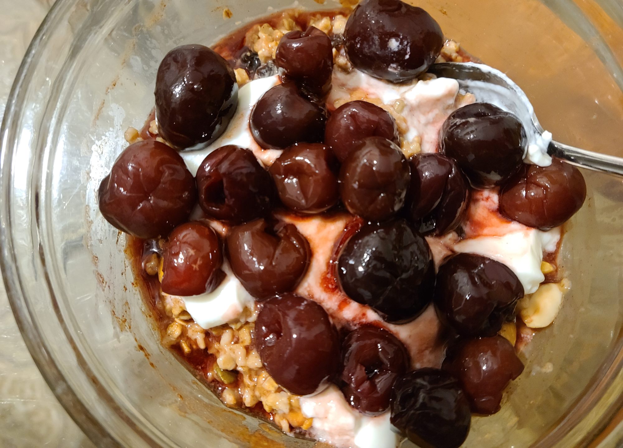 Cherries, probiotic yogurt, oats and nut, seeds mixture oatmeal breakfast