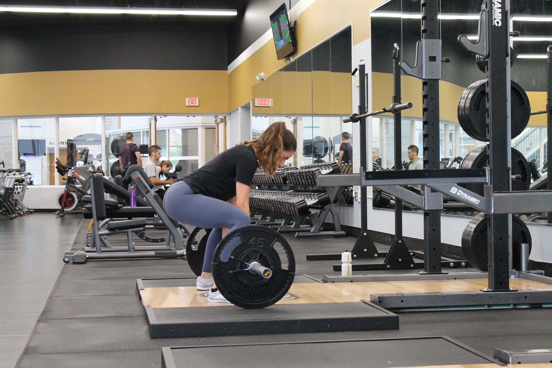 woman doing deadlift weight training exercise