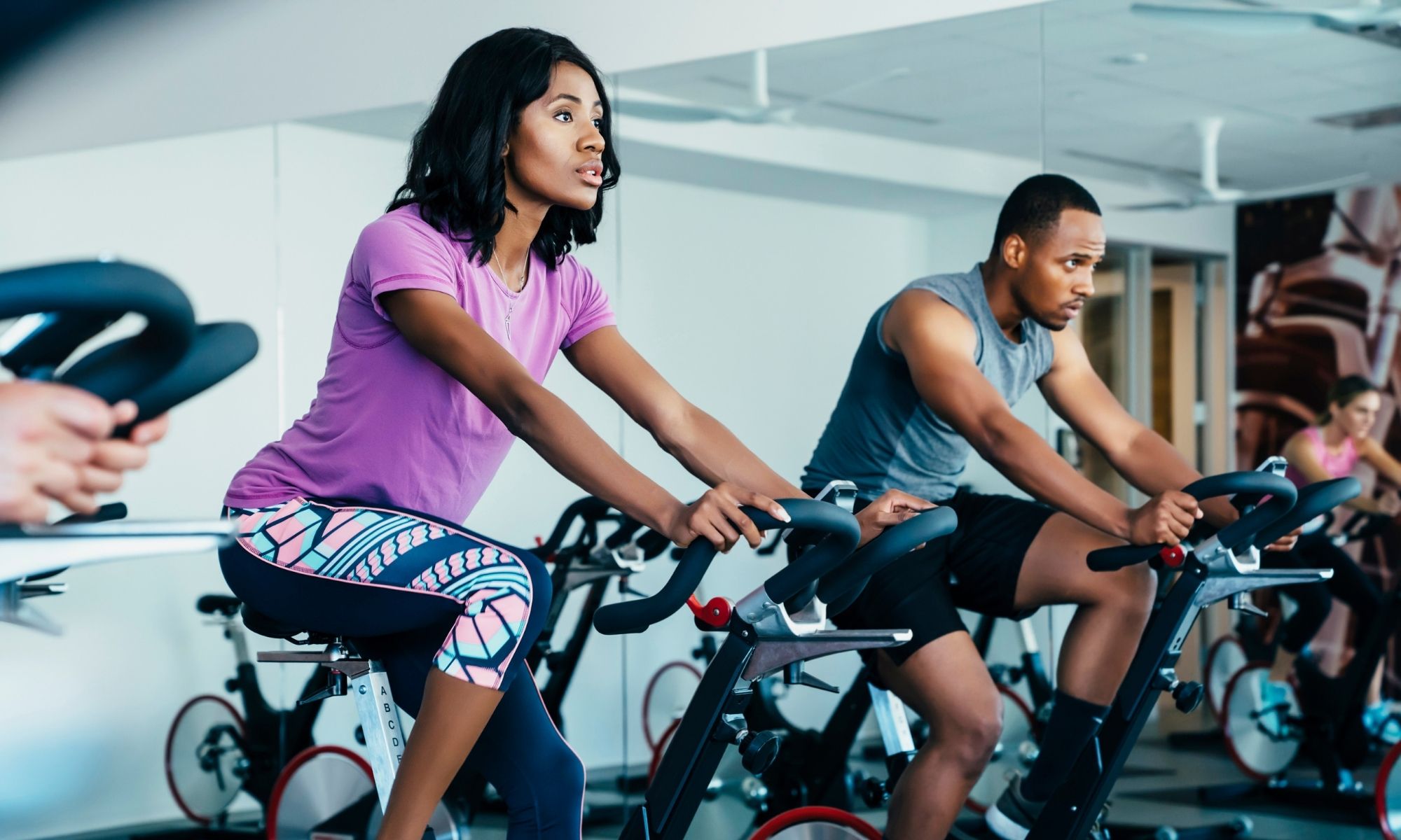 A group indoor cycling class. Group exercise clase.