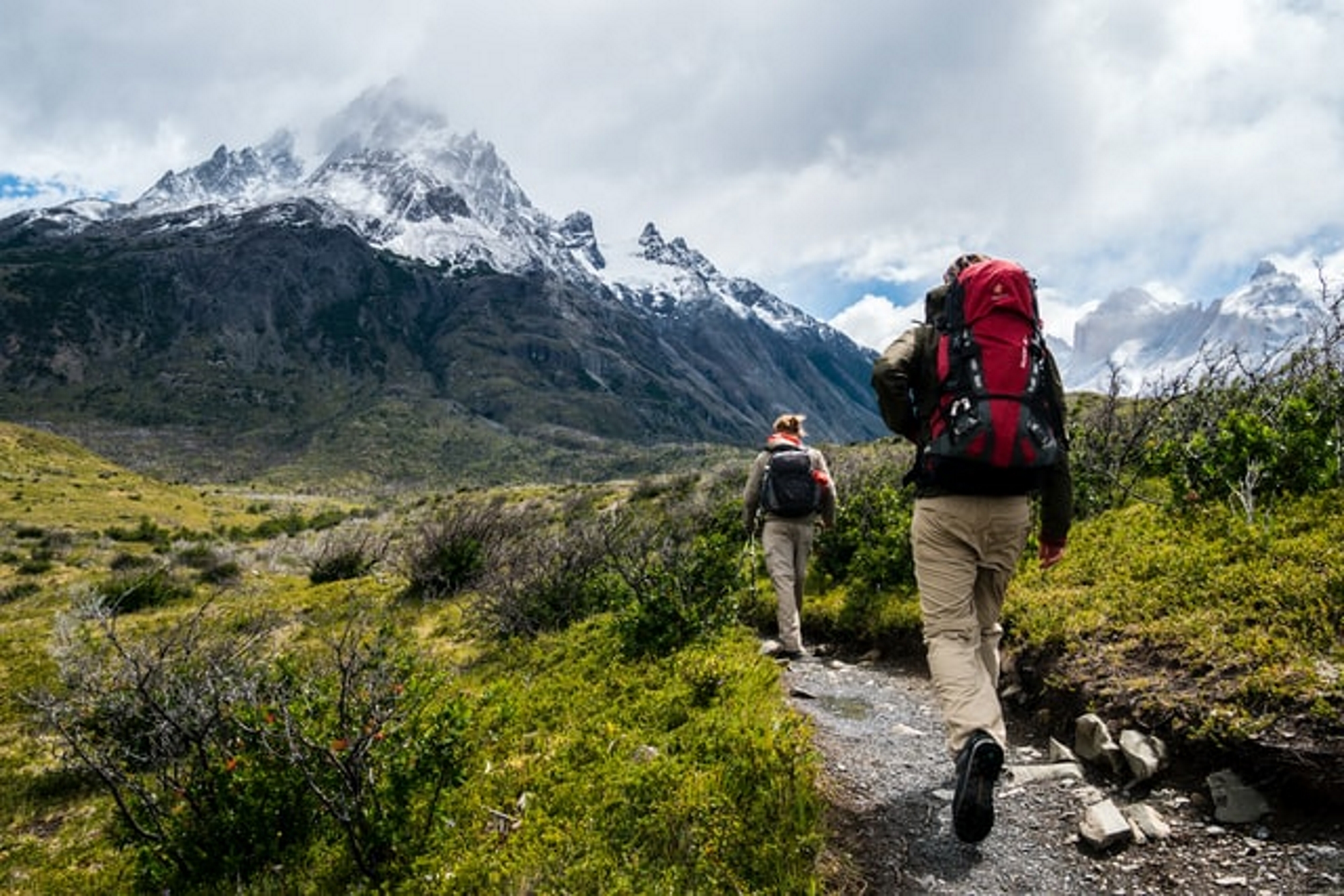 Two people hiking in the mountains.