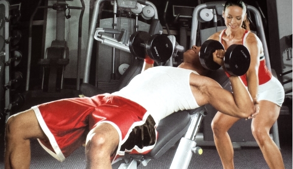 Incline dumbbell chest press by LL Cool J with the help of a spotter