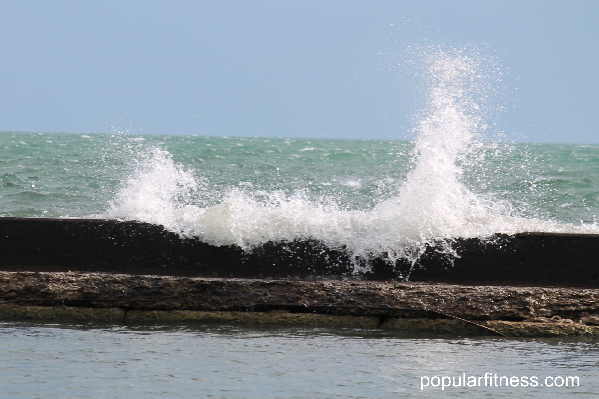 Lake Ontario waves hitting breakwall - photo by Peter Kudlacz - popular fitness