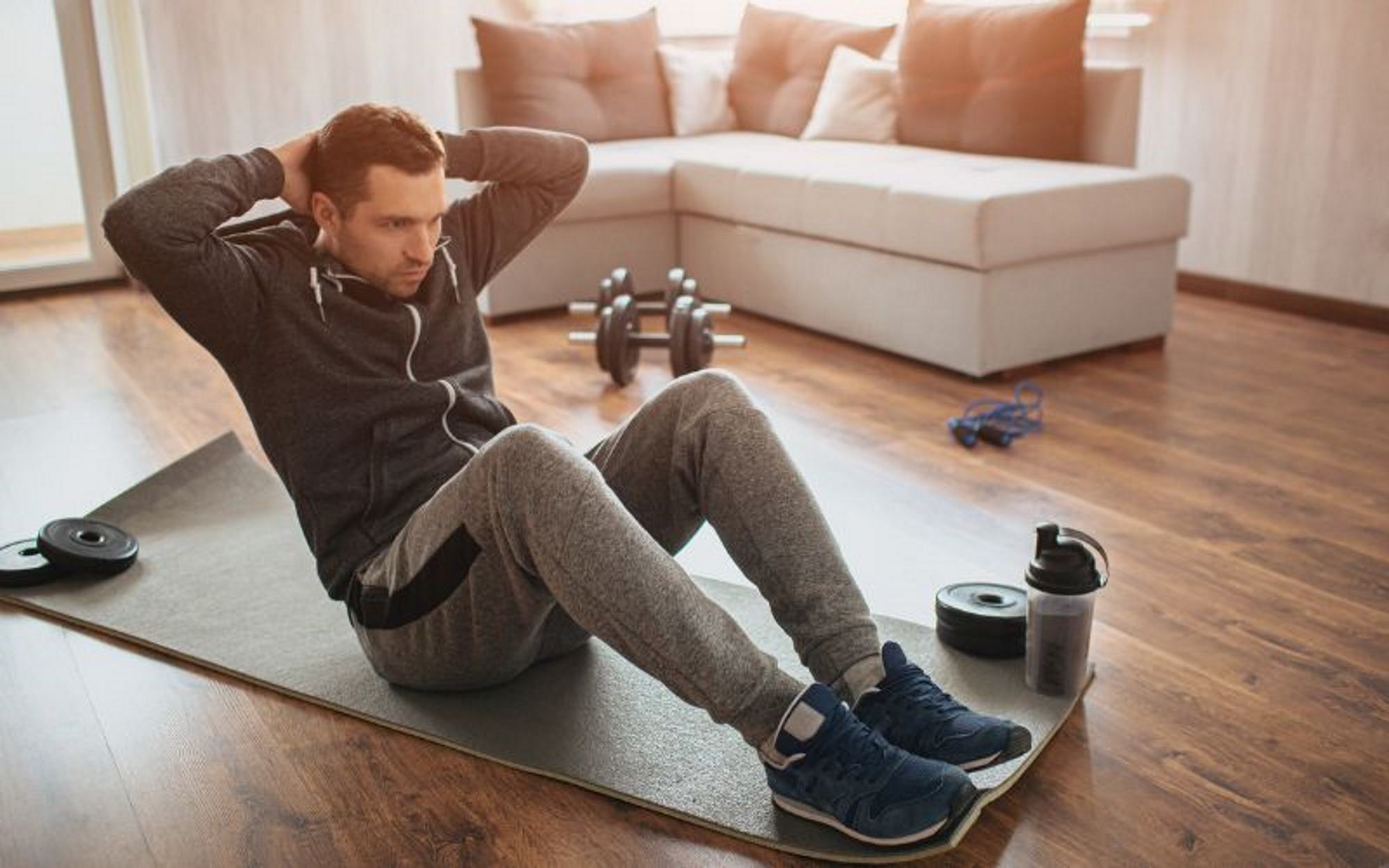 Man doing sit ups at home