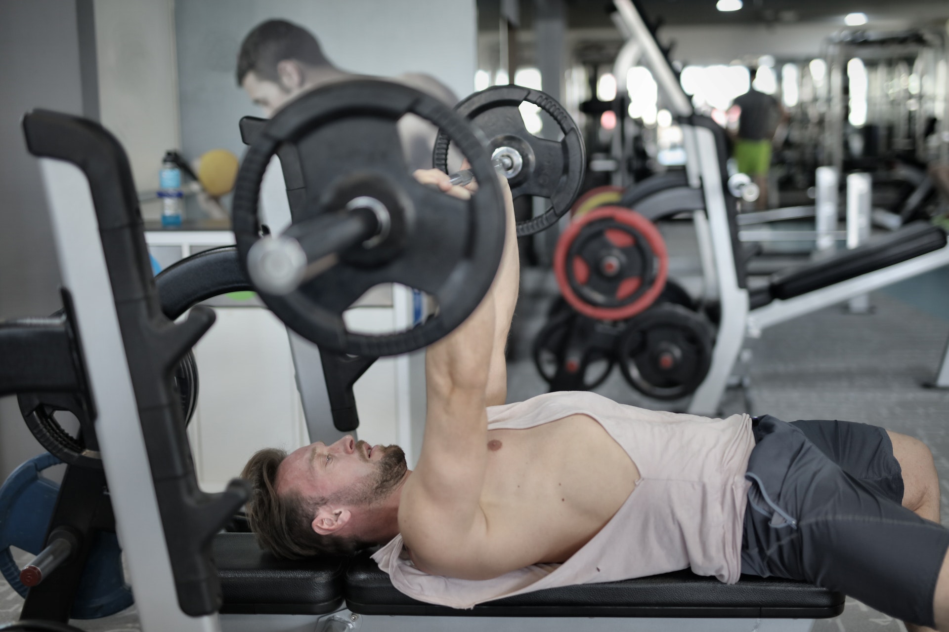 Man doing bench press chest exercise at the gym