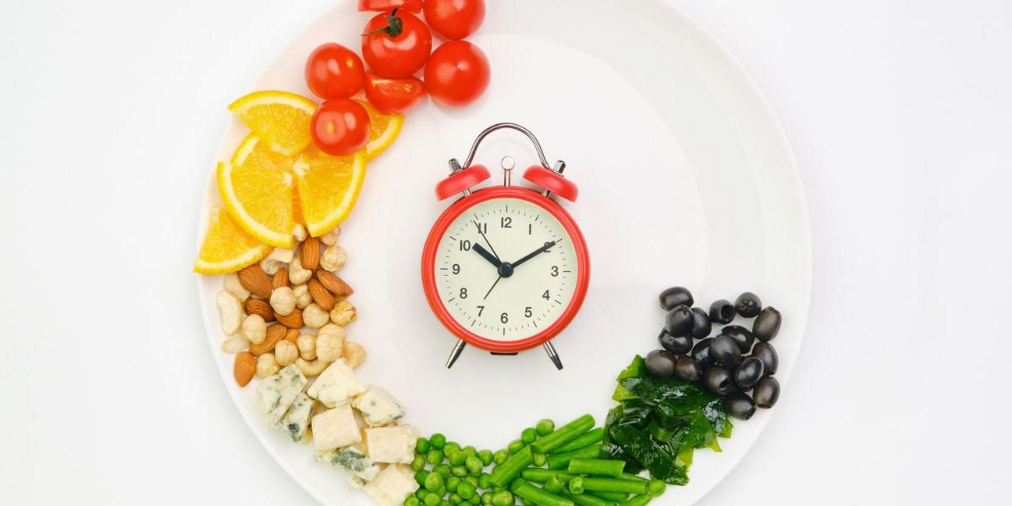 Clock with fruits, nuts and vegetables