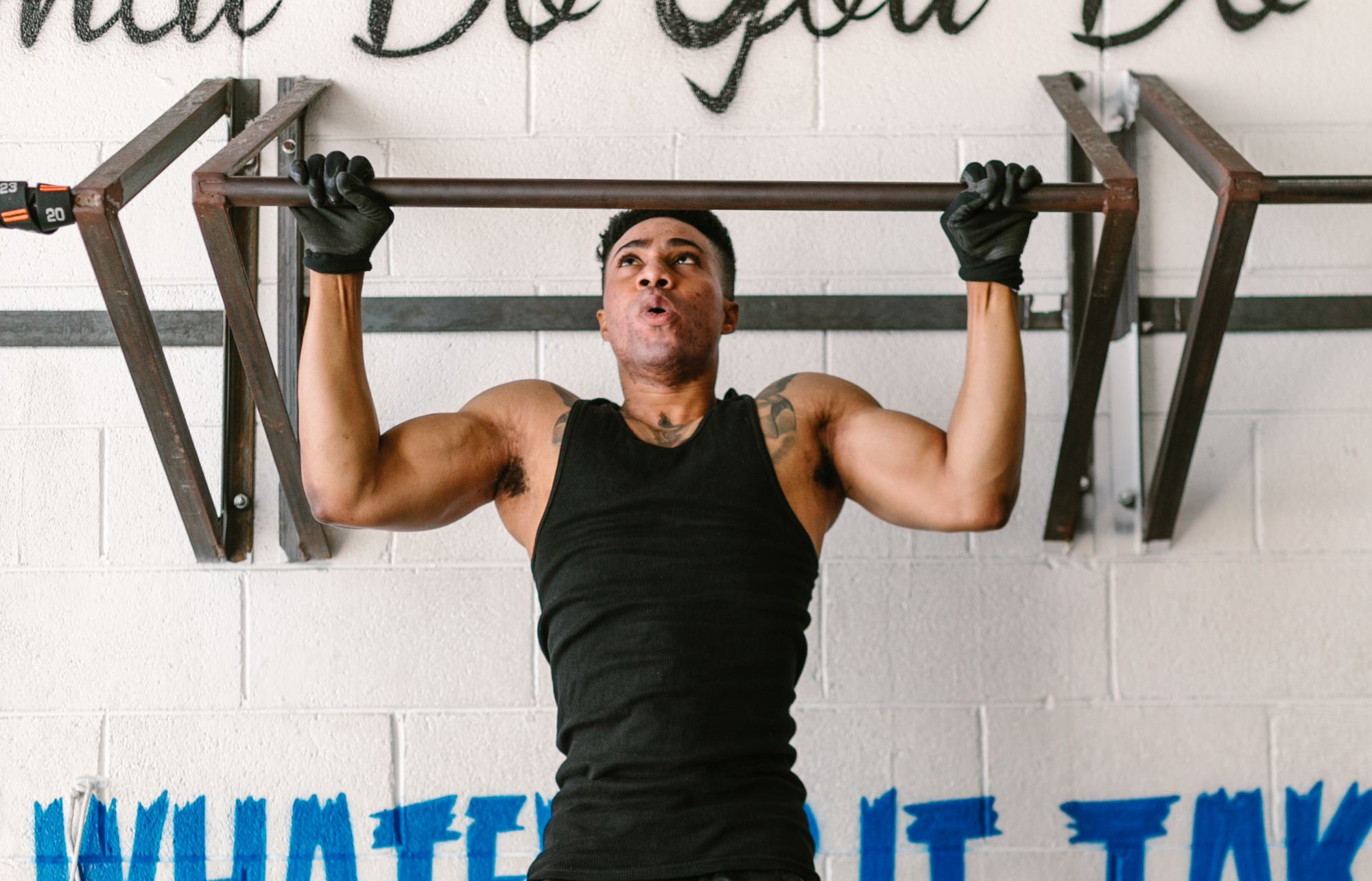 Man doing the pull up strength training, bodyweight exercise.