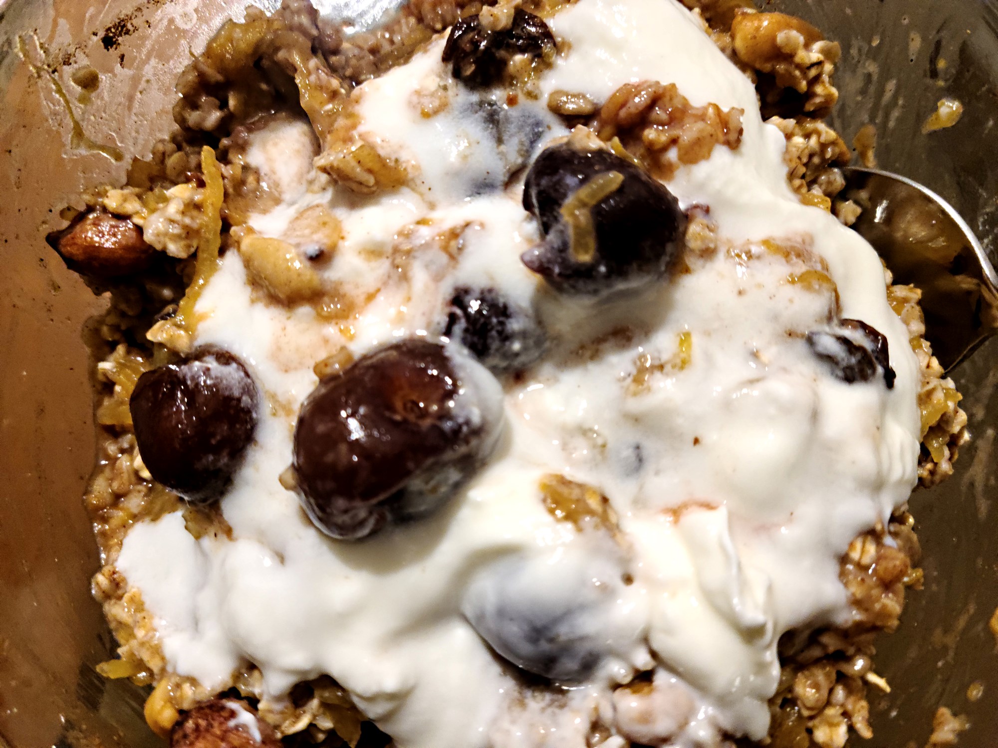 Pumpkin, cherries, probiotic yogurt and a variety of nuts, seeds oatmeal recipe for breakfast.