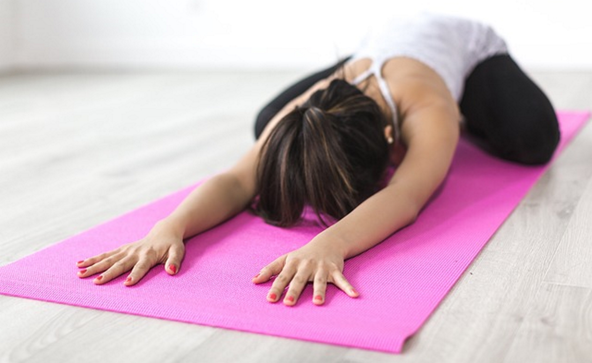 Woman doing a stretching exercise - yoga stretch