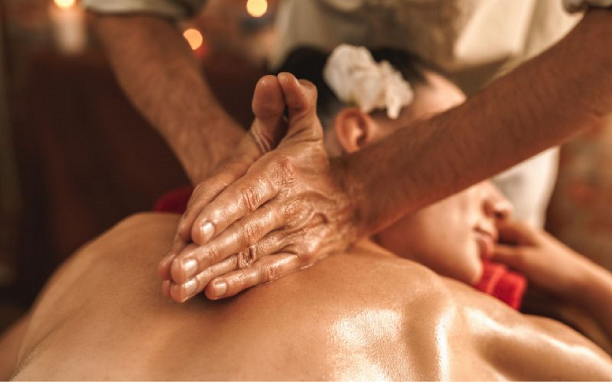 A woman enjoying a relaxing Abhyanga massage.