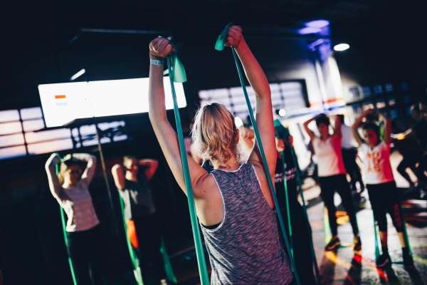 Exercising with resistance bands in group fitness class