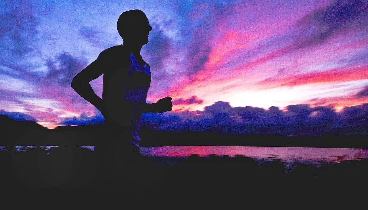 runner running during sunset