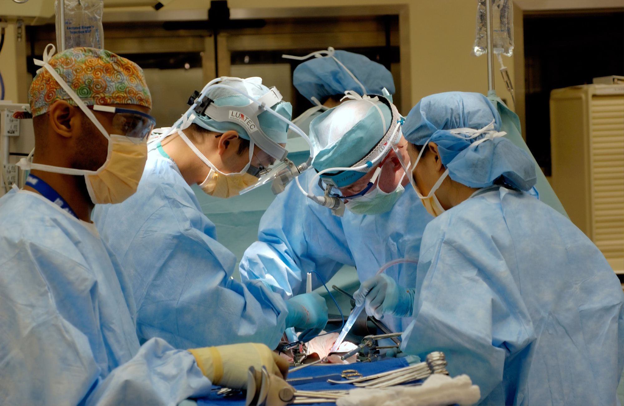 Surgeons and nurses in operating room
