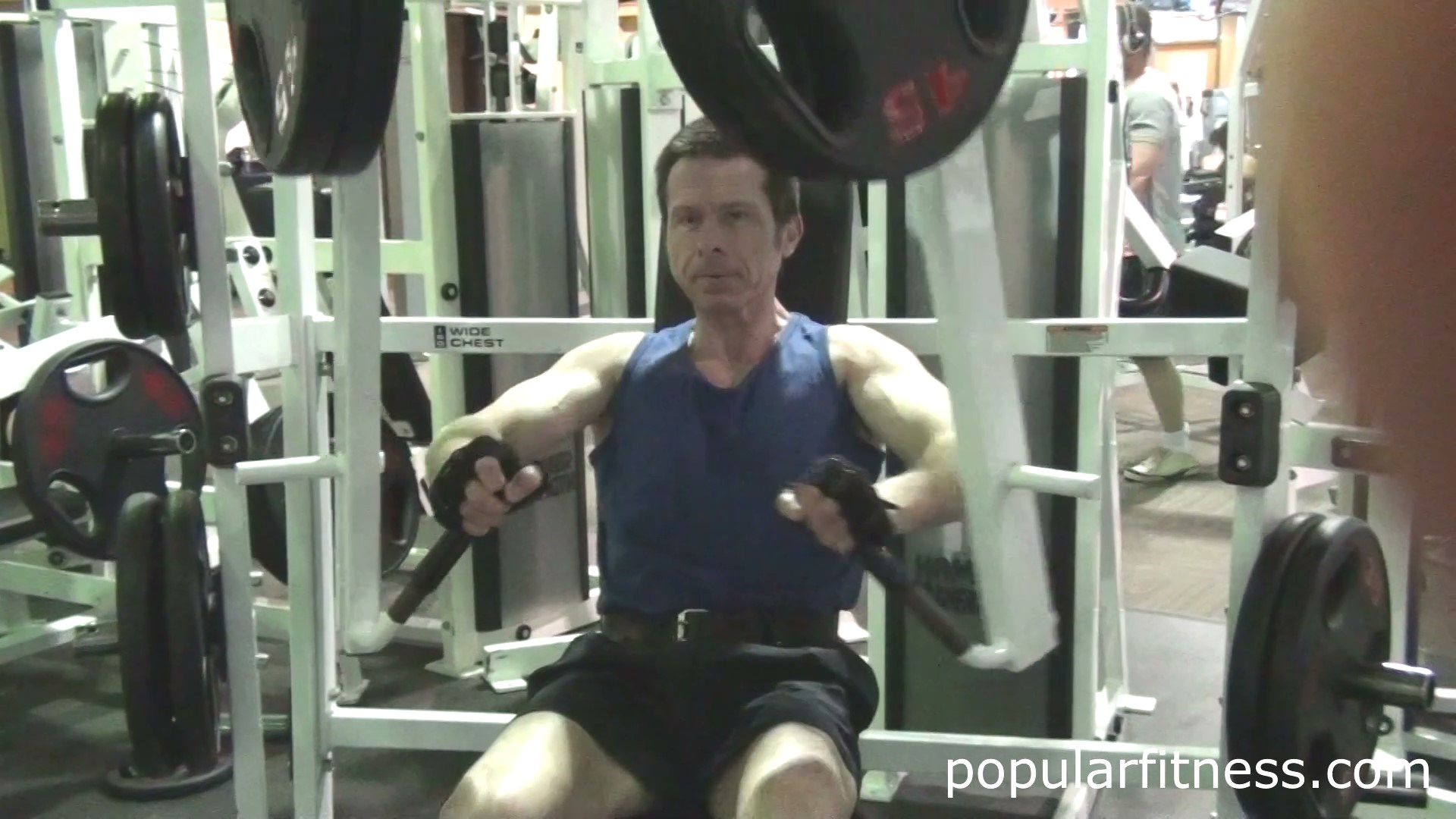 Wide chest press exercising using the Hammer Strength Machine - photo by popular fitness
