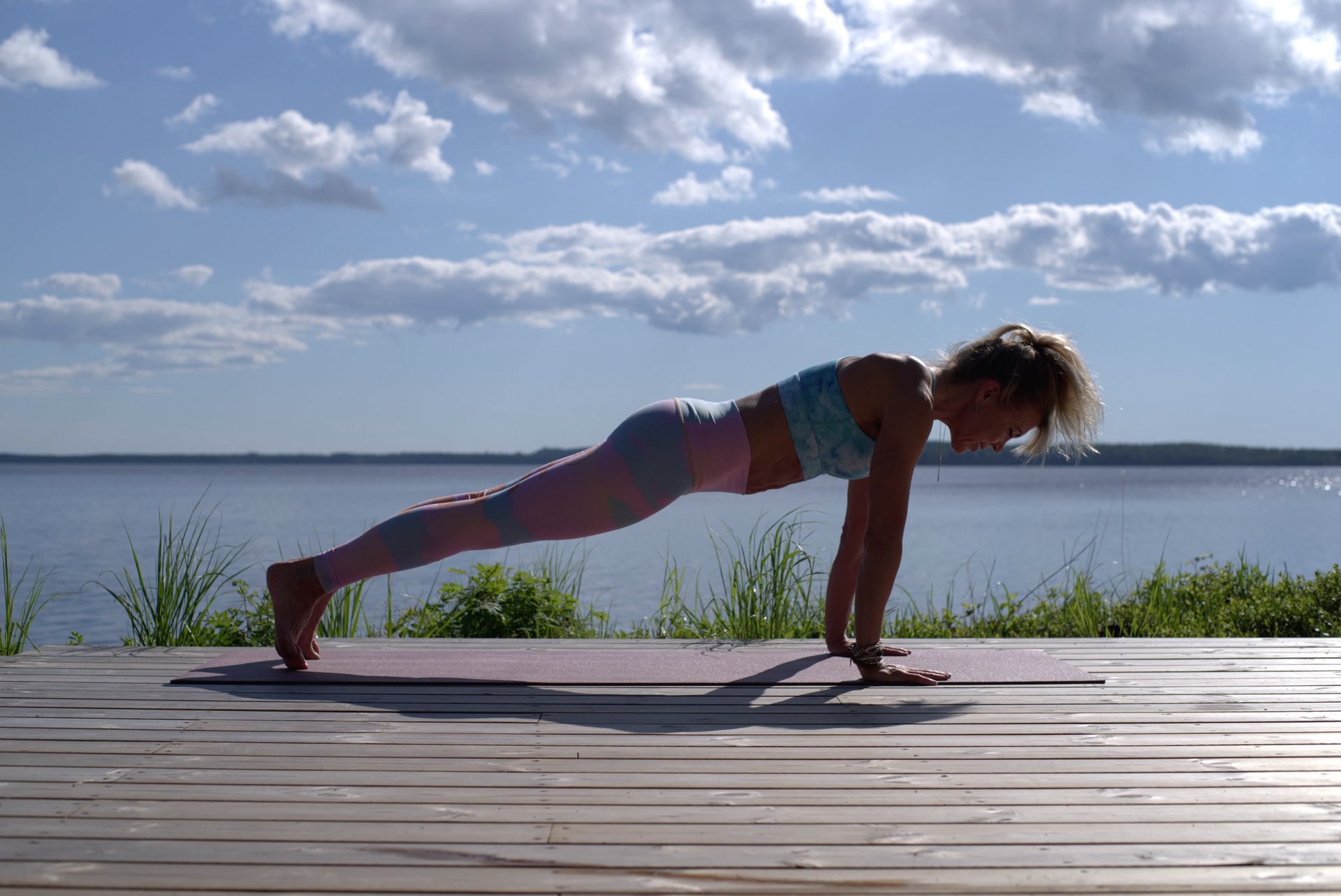 A wonan exercising, doing Yoga.