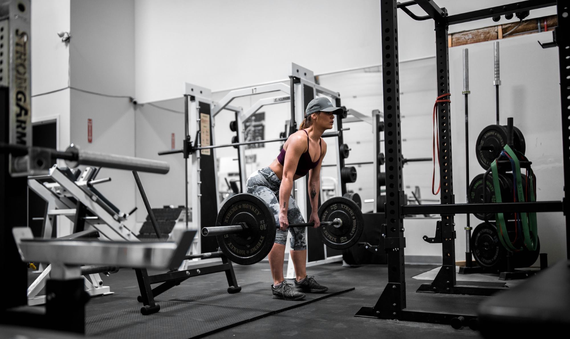 Woman doing deadlift exercise at the gyn