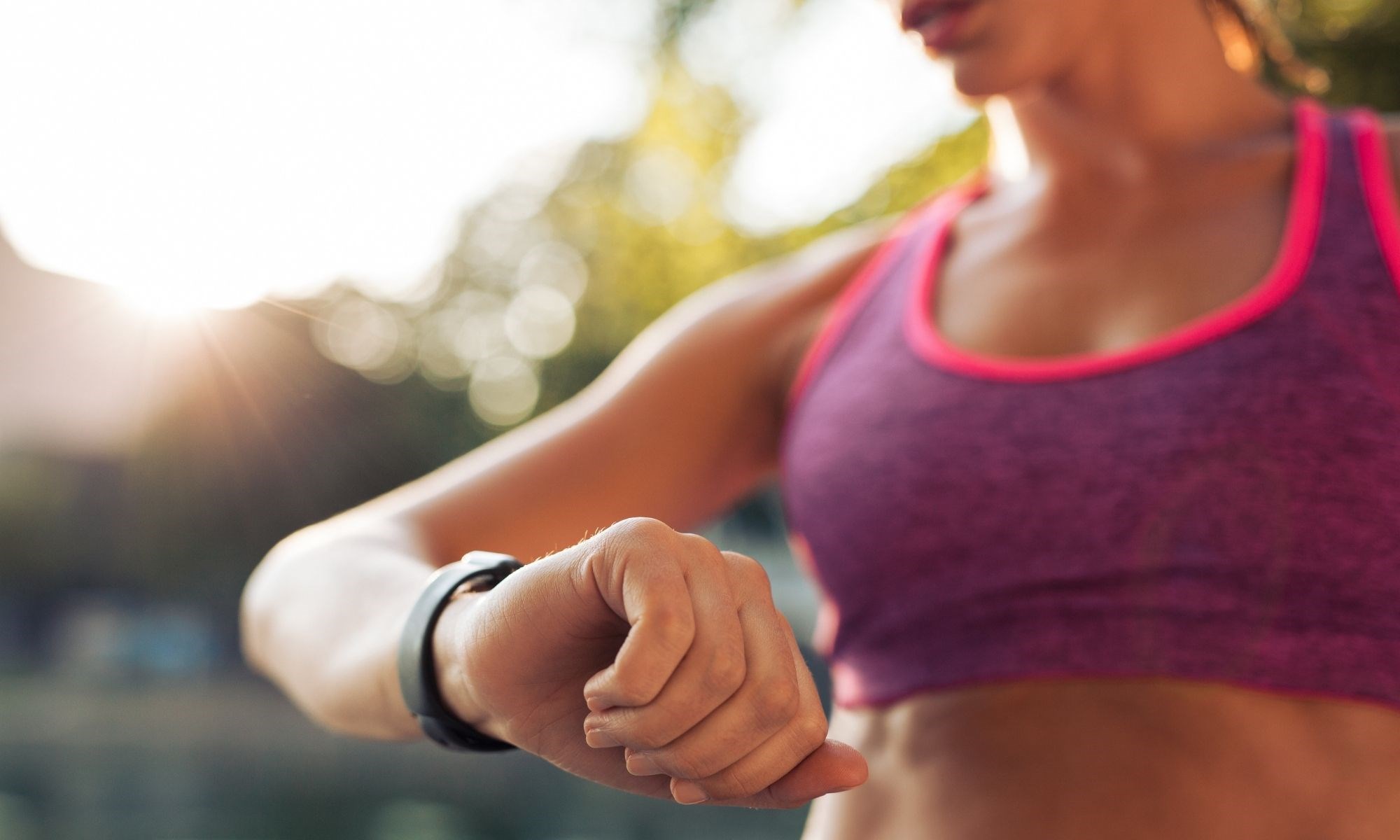 A woman timing her fitness training workout