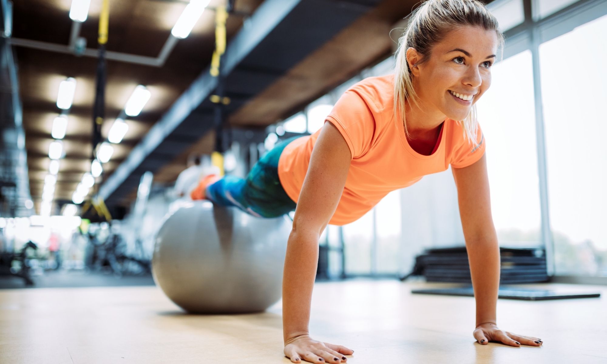 A woman exercising using a Swiss Ball or Exercise Ball.