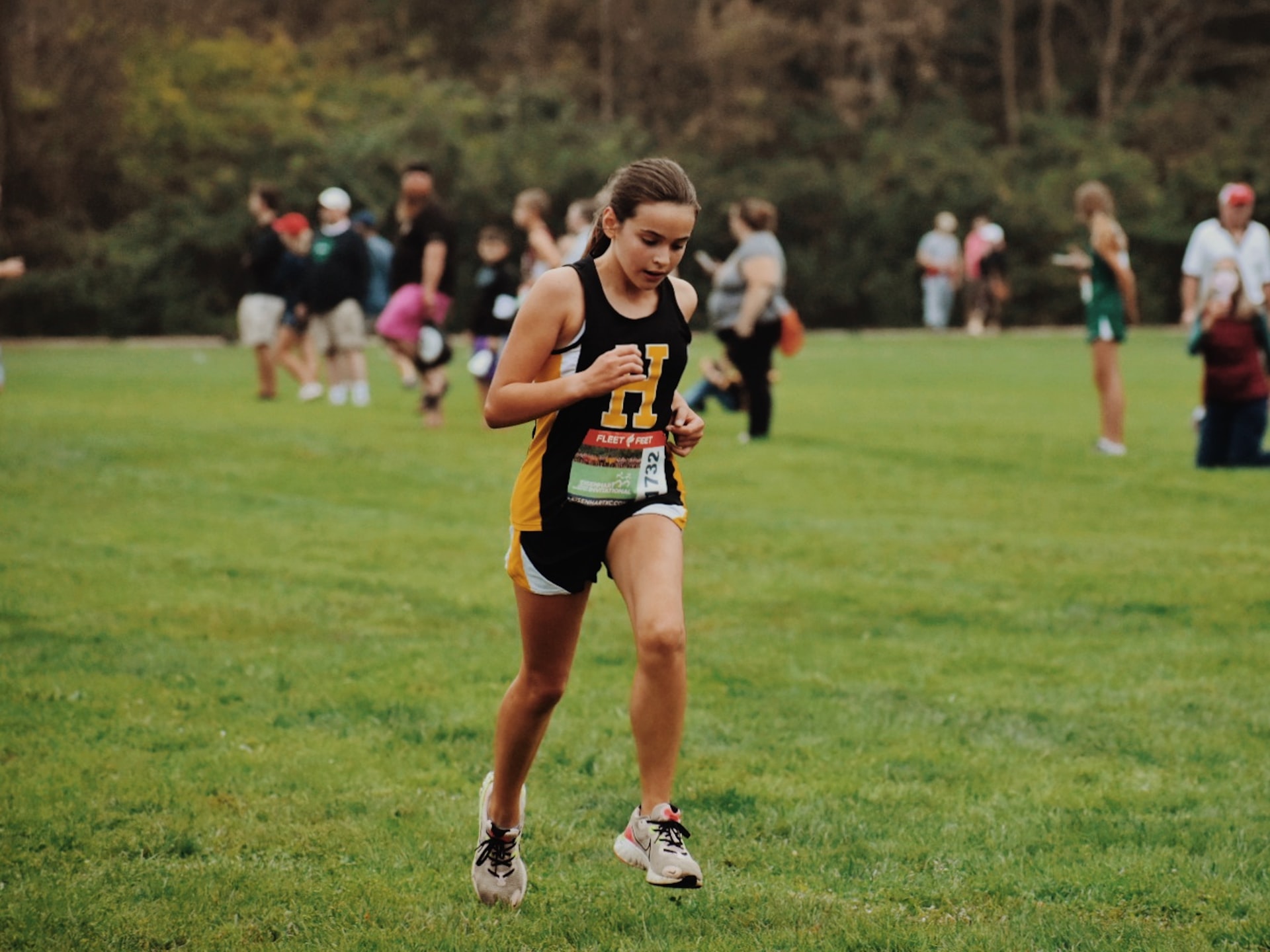 Young female athlete warming up for her run,running race.